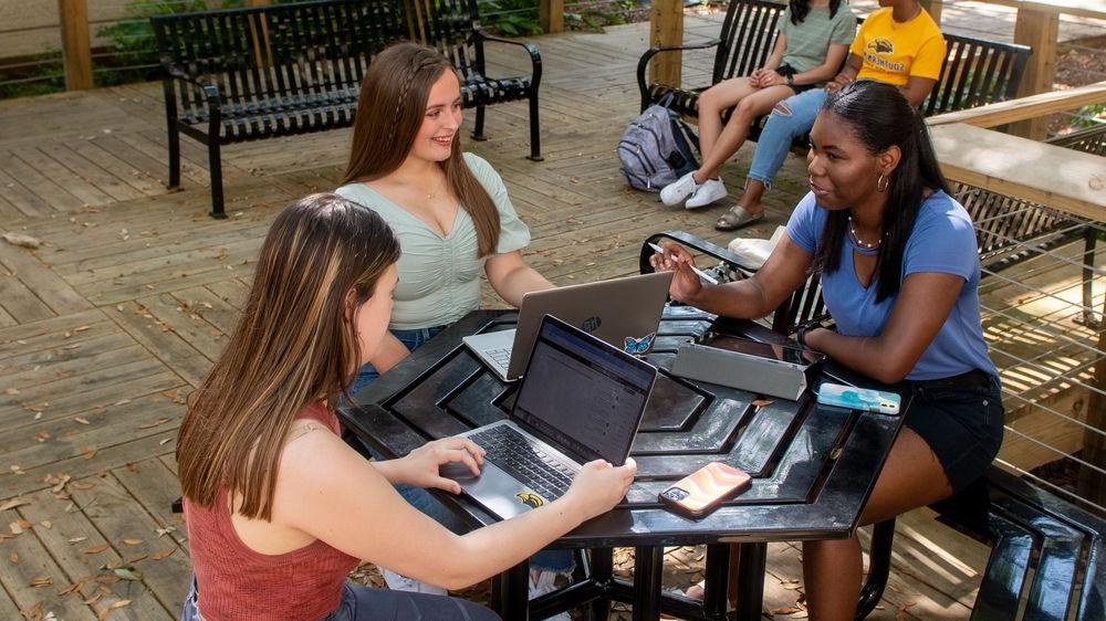 students talking at a table